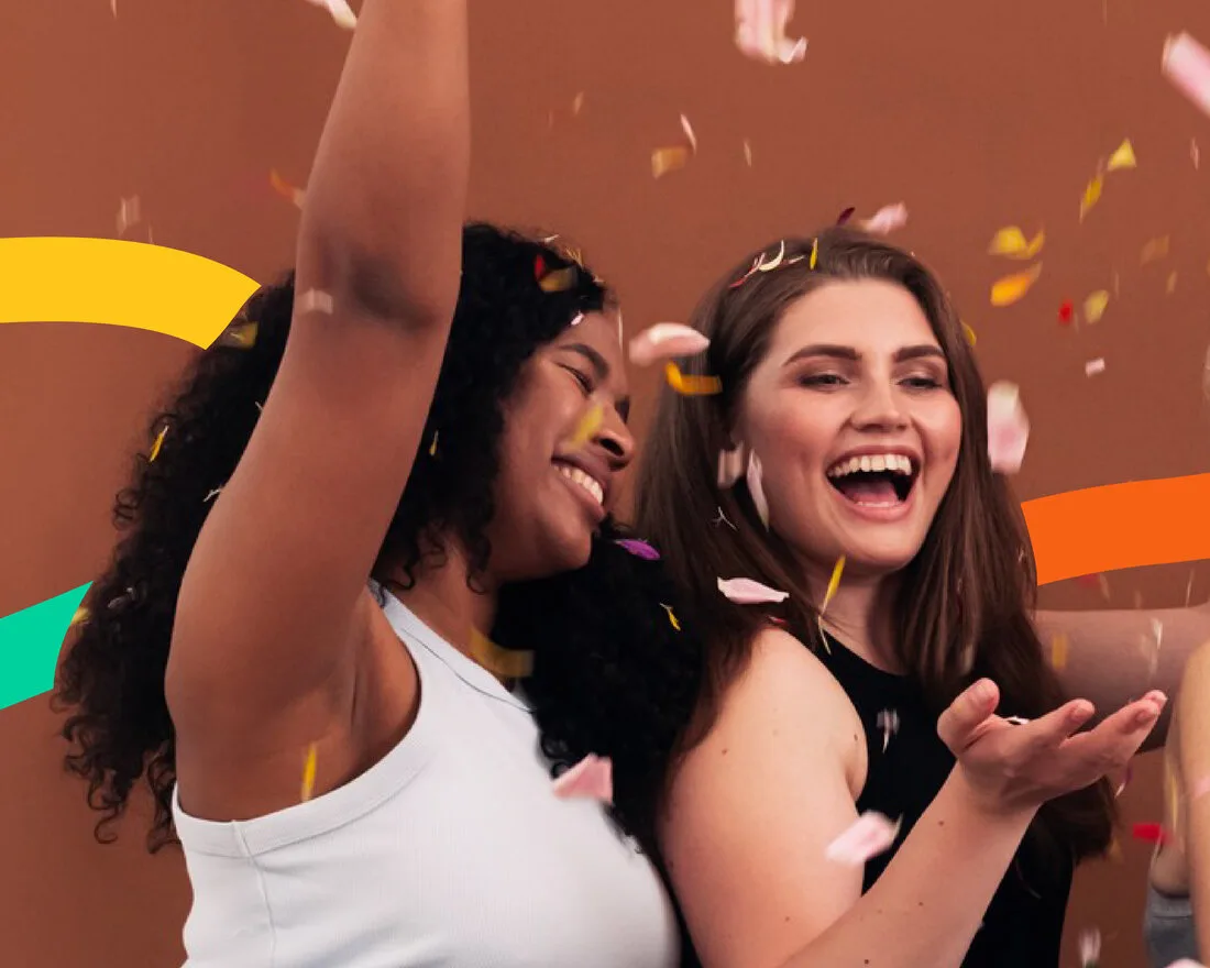 Girls celebrating together with confetti at a Brown Rice community event