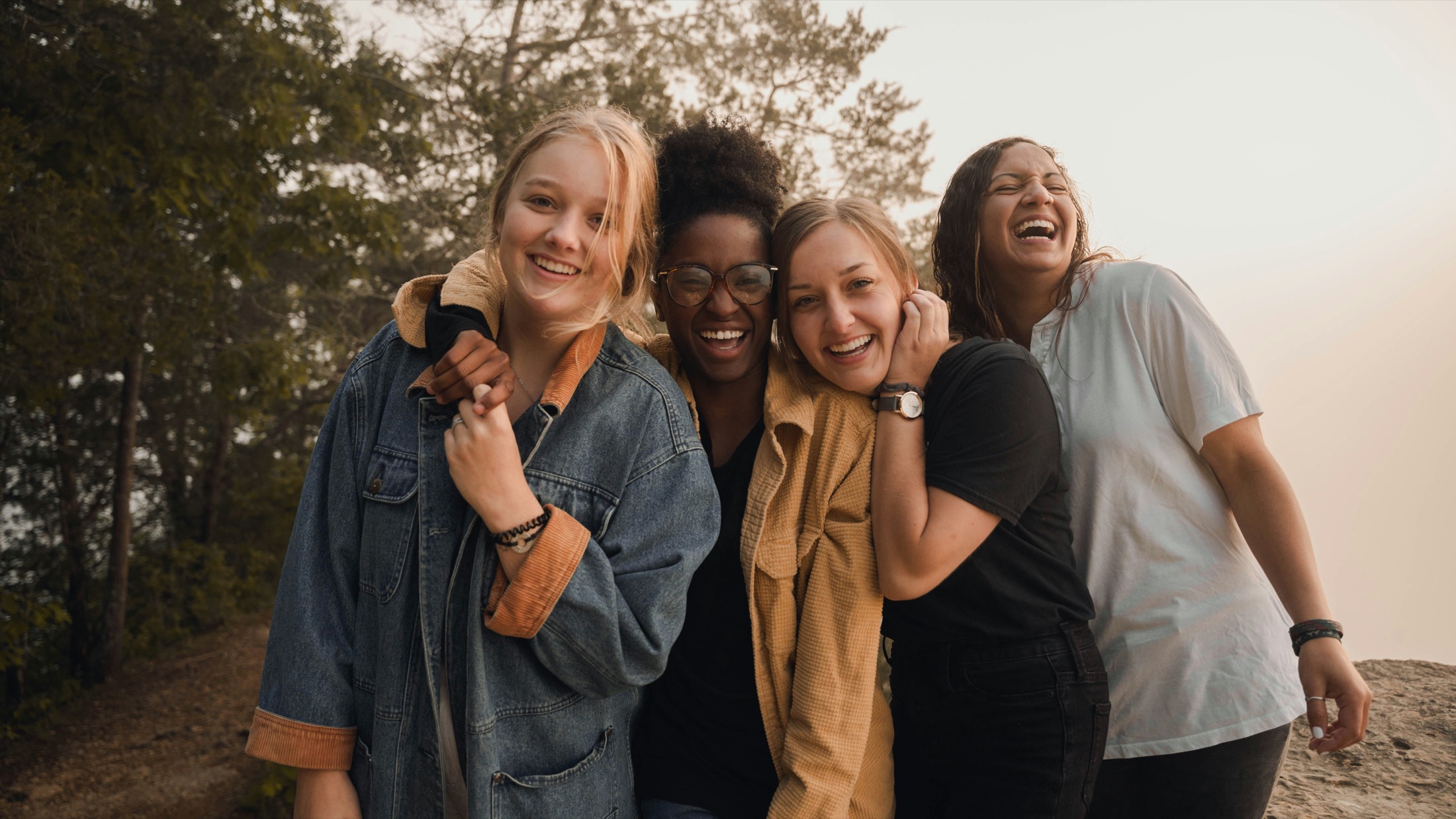 Young women laughing together outdoors